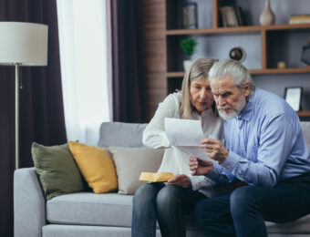 older couple checking list on how to rent your house